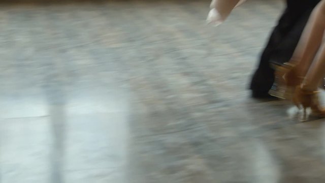 dancing pair is performing Latin American dance, rehearsing, closeup of legs