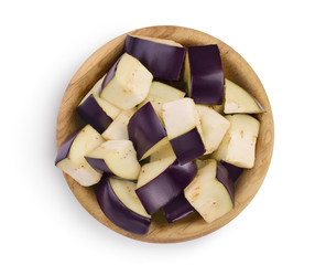 Eggplant or aubergine diced in wooden bowl isolated on white background with clipping path and full depth of field. Top view. Flat lay.