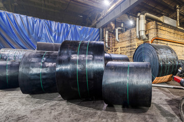 Interior of a factory for manufacturing rubber conveyor belts.