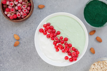 Healthy smoothie bowl with vegan protein, oat milk, frozen currants and mint. Breakfast smoothies