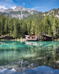 The lodge over the turquoise waters of Lago Ghedina, an alpine lake in Cortina D'Ampezzo, Dolomites, Italy