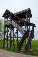 Fototapeta na wymiar Bird watching tower by a wetland in Biebrza National Park near Goniadz, eastern Poland.