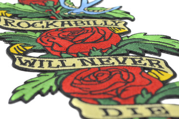 The embroidered patch. Attributes for bikers, rockers and metalheads. Patch with roses. Rockabilly will never die.