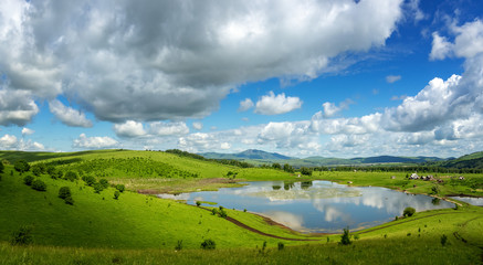 Altai mountain landscape with a lake and clouds, Russia, June