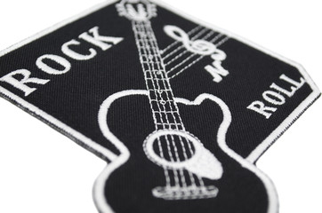 The embroidered patch. Attributes for bikers, rockers and metalheads. Patch with a guitar, treble...