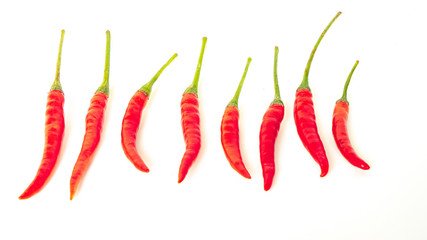 Group of red chili peppers isolated on white background.