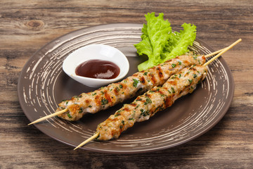 Minced pork skewer kebab with sauce