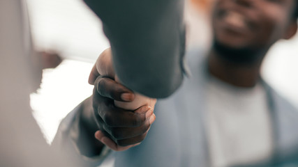 close up. image of a handshake of young business people