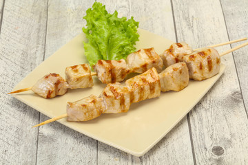 Grilled pork skewer served salad