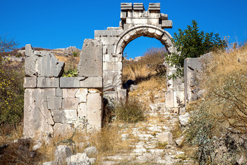 located in tlhe ancient city of Xanthos old stone gate to the city of Antalya, Turkey.