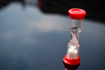 Red plastic game sand timer