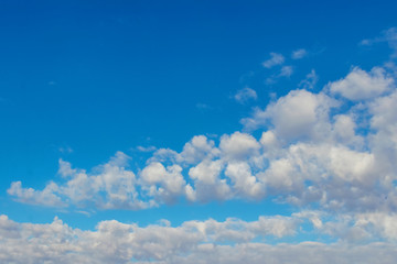 White fluffy clouds in the blue sky