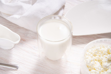 Milk in glass on wooden kitchen table