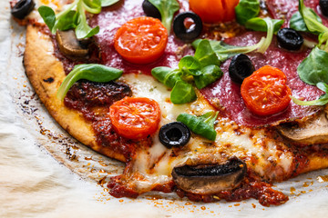 Margherita pizza on baking paper
