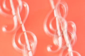 double exposure silvered clef on red background