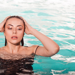 beautiful girl is relaxing in the Spa pool, relaxing and taking care of herself.