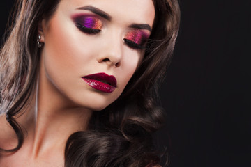Fototapeta premium Gorgeous young brunette in a chic evening look. Scarlet lips and eye shadow,