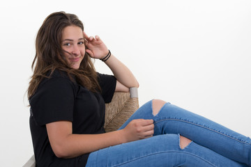 Fototapeta na wymiar portrait teenager girl young woman casual sitting portrait smile beautiful in studio over white background
