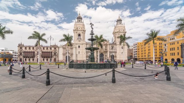 Fountain on The Plaza de Armas timelapse hyperlapse, also known as the Plaza Mayor, sits at the heart of Lima's historic center. Cathedral on a background