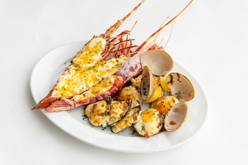 An assortment of baked seafood with cream and cheese