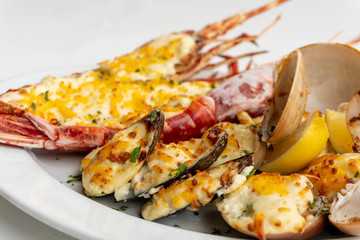 An assortment of baked seafood with cream and cheese