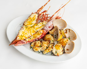 An assortment of baked seafood with cream and cheese