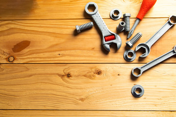 Mechanic tools toy on wood background. Top view. Plastic mechanic children Tool toy flat lay...