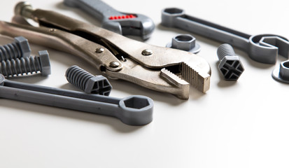 Obraz premium Top view. Plastic mechanic children Tool flat lay background. Space for text design. Mechanic Tools toy on white background