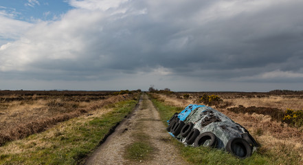Quite rural backroad through peat bog landscape in Ireland