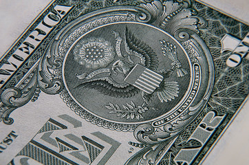 Fototapeta na wymiar macro photography of a 1 US dollar banknote. Ultra close up of a one American dollar note. US dollar is the world currency. The American silver eagle, printed in intaglio, on front side of the note