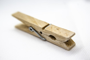 Wooden clothespin isolated in white background