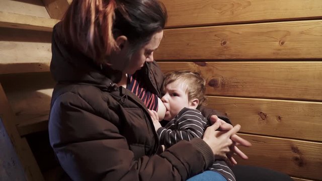 Mom breastfeeds a baby boy