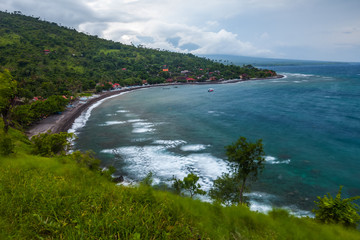 Fototapeta na wymiar Stormy coast in Amed village in Bali, Indonesia