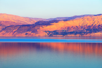 Dead Sea and mountains at sunset time