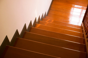 Brown wooden stair interior decorated modern style of residential house,Wooden stairs in the house, looking down.