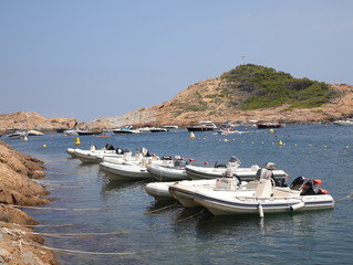 
motor boats moored in the bay, where they are waiting for their tourists for a walk on the sea