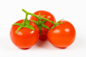 Fresh ripe red tomatoes on white background