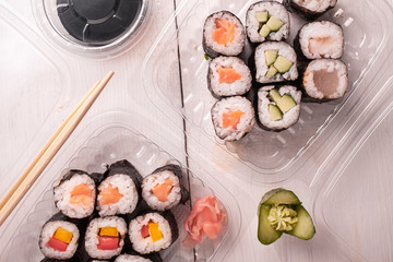 sushi in a plastic containers