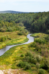 Fototapeta na wymiar Beautiful landscape of Russian nature, view from the mountain to the forest and river on a sunny summer day