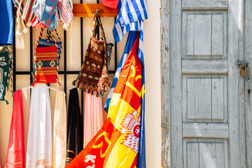 Street souvenir shop, colorful scarves and bags in Athens, Greece