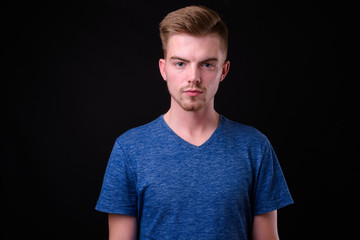 Obraz premium Portrait of young handsome blond bearded man