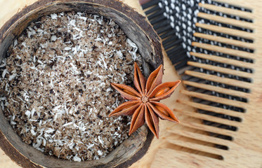 Homemade face and body scrub (foot soak) with sugar, ground cofee, coconut oil and shredded coconut. Diy natural beauty treatment and spa recipe. Close up, top view, copy space