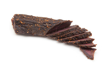 Beef Biltong, South African Beef Jerky isolated on a white studio background.