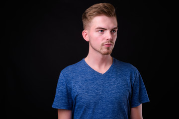 Fototapeta premium Portrait of young handsome blond bearded man