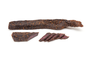 Beef Biltong, South African Beef Jerky isolated on a white studio background.