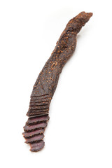 Beef Biltong, South African Beef Jerky isolated on a white studio background.