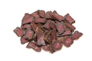 Beef Biltong, South African Beef Jerky isolated on a white studio background.