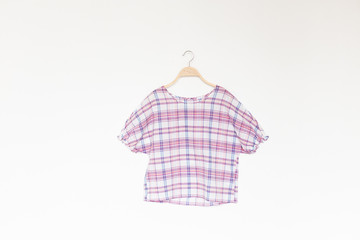 Woman blouse with summer blouse cotton on white background.