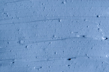 Light blue bentonite facial clay (mask, face cream, body wrap) texture close up, selective focus....