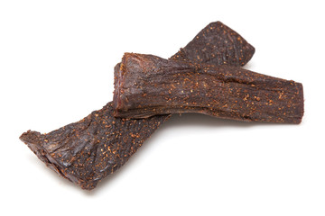 Beef Biltong, South African Beef Jerky isolated on a white studio background.